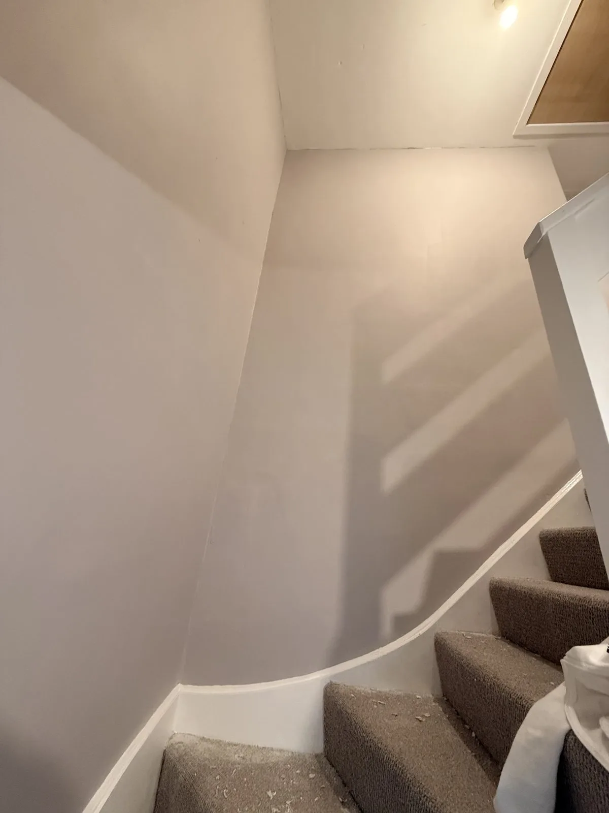 Tall stairwell walls, smooth even finish — painting and decorating by LJAY’s